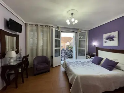 Cama o camas de una habitación en Hostal Avenida