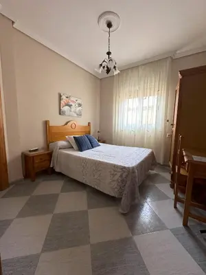 Cama o camas de una habitación en Hostal Avenida