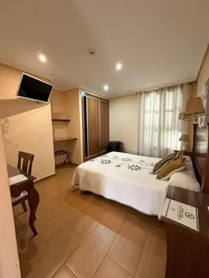 Cama o camas de una habitación en Hostal Avenida
