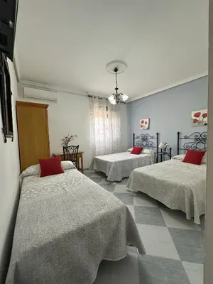 Cama o camas de una habitación en Hostal Avenida
