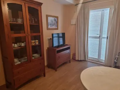 Una televisión o centro de entretenimiento en Duplex extraordinario naturista en Vera Playa!