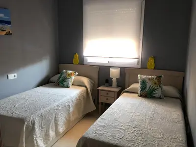 Cama o camas de una habitación en Atico con piscina privada a 100m del mar