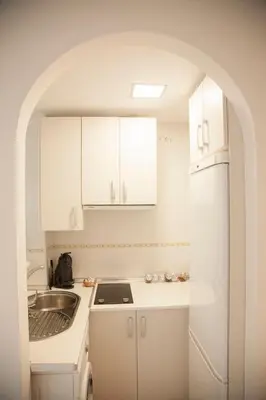Una cocina o zona de cocina en Coqueto Apartamento con vistas al mar y piscina