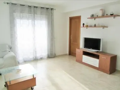 Una televisión o centro de entretenimiento en Apartamento Playa de Garrucha