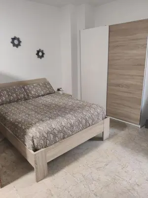 Cama o camas de una habitación en playa Almería zapillo loft
