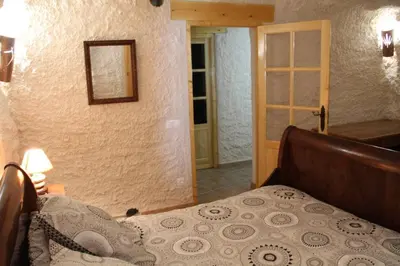 Cama o camas de una habitación en CUEVAS AL ANDALUS - Alegria
