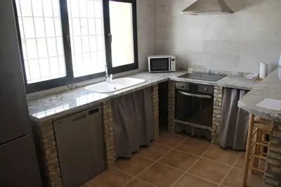 Una cocina o zona de cocina en CUEVAS AL ANDALUS - Alegria