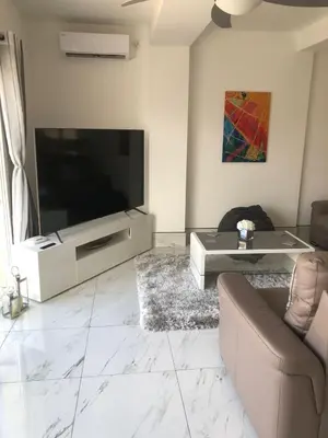 Una televisión o centro de entretenimiento en Casa Olivia villa