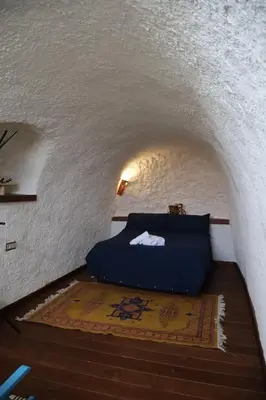 Cama o camas de una habitación en CASA CUEVA PIENA, Alcudia de Guadix