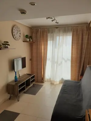 Una televisión o centro de entretenimiento en Vera Apartamento Marina Rey