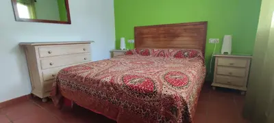Cama o camas de una habitación en PiedraNegra, apartamento completo con patio, terraza y BBQ