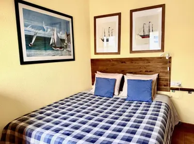Cama o camas de una habitación en Primera Linea de Playa con vistas al Mar