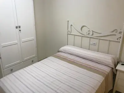 Cama o camas de una habitación en Atico con piscina privada y vistas al mar