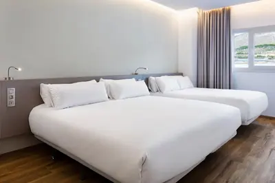 Cama o camas de una habitación en B&B HOTEL Almería Vicar