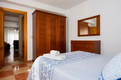 Cama o camas de una habitación en Apartamentos Sol Andaluz
