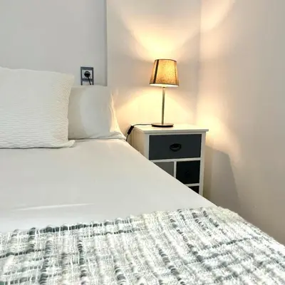 Cama o camas de una habitación en TAÍNA Apartamento