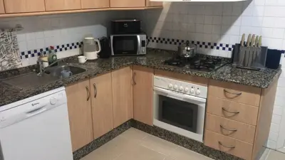 Una cocina o zona de cocina en Palacio De La Marina