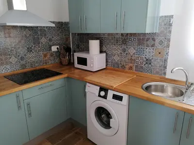 Una cocina o zona de cocina en Apartamentos Cala San Pedro