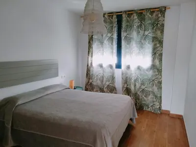 Cama o camas de una habitación en Apartamentos Cala San Pedro