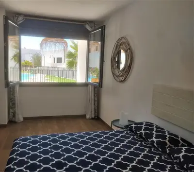 Cama o camas de una habitación en Apartamentos Cala San Pedro