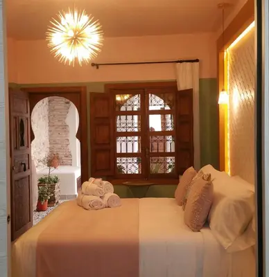 Cama o camas de una habitación en Murallas de Jayrán Hotel Boutique