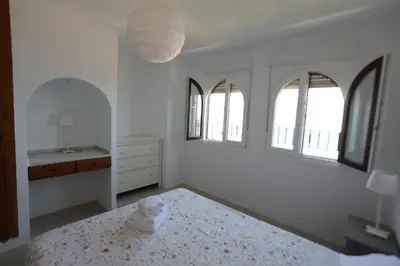 Cama o camas de una habitación en CasaMarga San José Precioso apartamento con piscina y vistas al mar