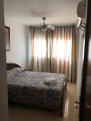 Cama o camas de una habitación en APARTAMENTO JUNTO A LA PLAYA