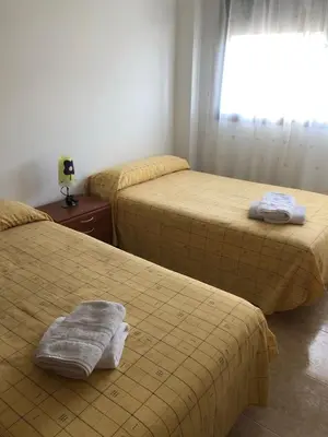 Cama o camas de una habitación en APARTAMENTO JUNTO A LA PLAYA