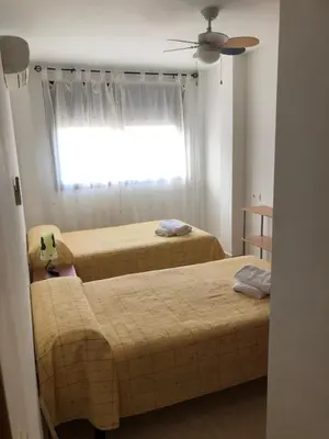 Cama o camas de una habitación en APARTAMENTO JUNTO A LA PLAYA
