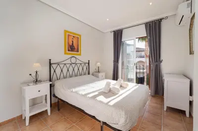 Cama o camas de una habitación en Homes of Spain, Al Andalus Residencial V Apartamento precioso con WIFI