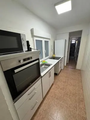 Una cocina o zona de cocina en Paseo marítimo ALMERIA RL