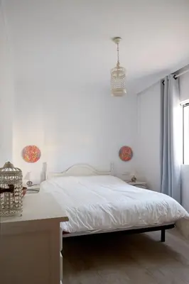 Cama o camas de una habitación en La Aldea de Puerto Rey - apartamento a 300 metros del mar con wifi y parking