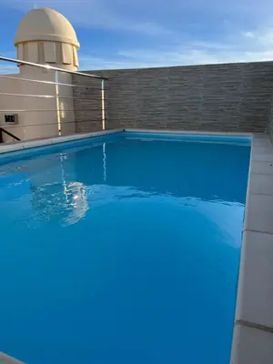 Piscina en o cerca de Atico con piscina privada vistas al mar