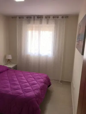 Cama o camas de una habitación en Atico con piscina privada vistas al mar