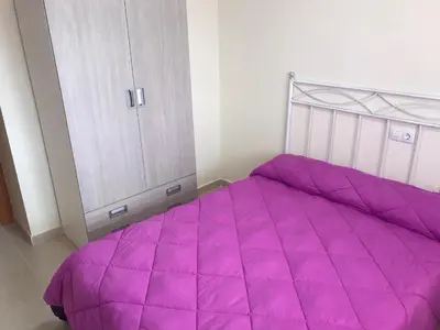 Cama o camas de una habitación en Atico con piscina privada vistas al mar