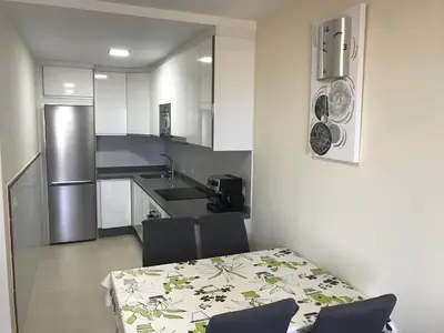 Una cocina o zona de cocina en Atico con piscina privada vistas al mar