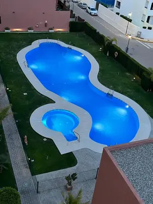 Piscina en o cerca de Atico con piscina privada vistas al mar