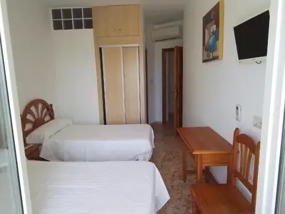 Cama o camas de una habitación en Pensión sol y playa