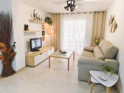 Una televisión o centro de entretenimiento en Vivienda en residencial con piscina