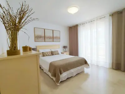 Cama o camas de una habitación en Vivienda en residencial con piscina