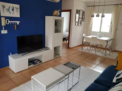 Una televisión o centro de entretenimiento en Cozy apartment in Vera Playa, Almeria, Andalucia, Spain