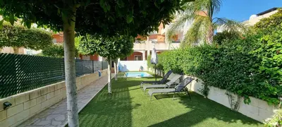 Jardín al aire libre en Homes of Spain, Apartamentos Paraíso Vera Playa, Ed Nuku Hiva, Bajo X con PISCINA PRIVADA y jardín privado a PIE de PLAYA , WIFI