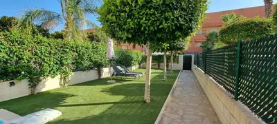 Jardín al aire libre en Homes of Spain, Apartamentos Paraíso Vera Playa, Ed Nuku Hiva, Bajo X con PISCINA PRIVADA y jardín privado a PIE de PLAYA , WIFI