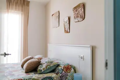 Cama o camas de una habitación en Apartamentos Delamar
