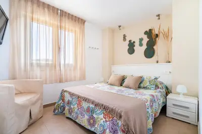 Cama o camas de una habitación en Apartamentos Delamar