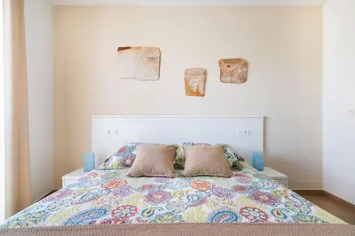 Cama o camas de una habitación en Apartamentos Delamar