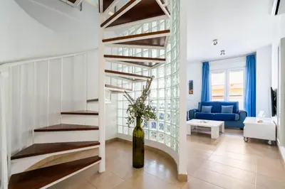 Cama o camas de una habitación en Apartamentos Delamar