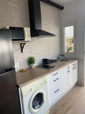 Una cocina o zona de cocina en Vivienda de uso turístico Los Escullos
