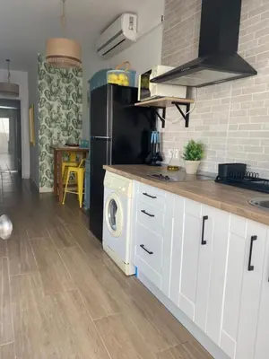 Una cocina o zona de cocina en Vivienda de uso turístico Los Escullos