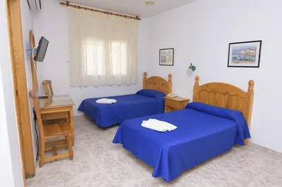 Cama o camas de una habitación en HOTEL DON FELIPE